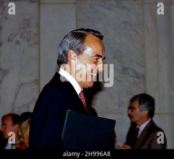 **FILE PHOTO** Bob Dole Has Passed Away at 98. Washington DC, USA, March 29, 1988. Republican Senator Robert Dole of Kansas with his wife Elizabeth Hanforth Dole and daughter Robin at his side announces during a news conference in the Russell Senate Office Building Caucus Room his decision to withdrawal from the Presidential campaign and move to support Vice President George H.W. Bush in his efforts to win the election. Credit: Mark Reinstein/MediaPunch Stock Photo