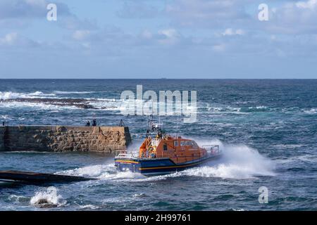 The Tamar class City of London III lifeboat being launched from it's home station of Sennen Cove Lifeboat station in Cornwall. Stock Photo