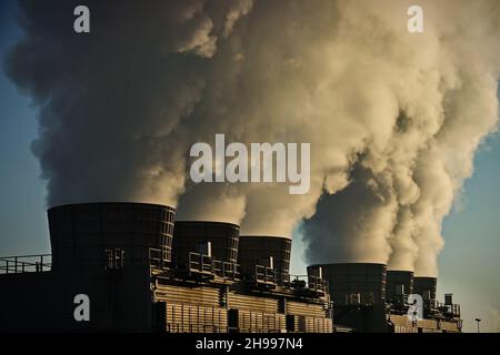 Factory chimneys with smoke emission. Industrial factory pollution, smokestack exhaust gases. factory chimney