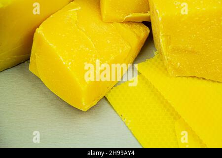 large pieces of natural beeswax, close-up, raw materials for candles Stock Photo