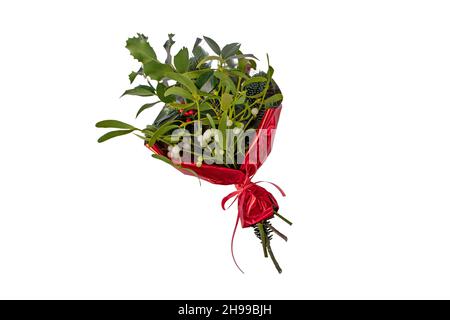 Bouquet of Christmas holly, mistletoe and fir tree in red wrapping isolated on white Stock Photo