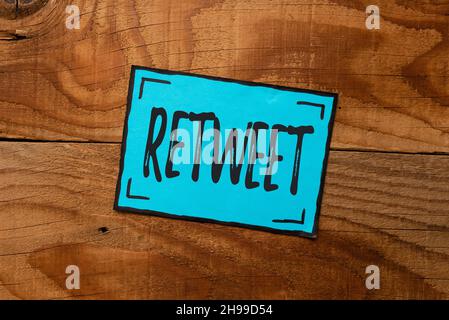 Hand writing sign Retweet. Concept meaning in twitter repost or forward a message posted by another user Setting New Ideas Creating Fresh Thoughts Stock Photo