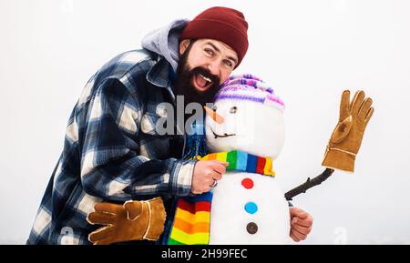 Bearded man with Christmas snowman. Leisure in winter. Happy winter time. Man playing with Snowmen Stock Photo