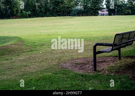 Metal Park bench from the rear in Greenlands Park, Dinnington, South Yorkshire Stock Photo