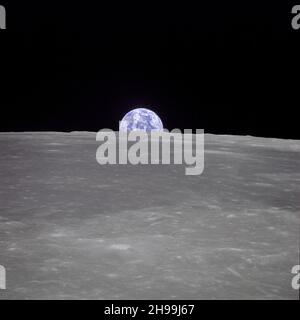 View of Earth from the Apollo 11 spacecraft shows Earth rising above the moon's horizon. Stock Photo