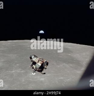 The Apollo 11 Lunar Module ascent stage, with astronauts Neil A. Armstrong and Edwin E. Aldrin Jr. aboard, is photographed from the Command and Service Modules (CSM) during rendezvous in lunar orbit. The Lunar Module (LM) was making its docking approach to the CSM. Astronaut Michael Collins remained with the CSM in lunar orbit while the other two crewmen explored the lunar surface. The large, dark-colored area in the background is Smyth's Sea, centered at 85 degrees east longitude and 2 degrees south latitude on the lunar surface (nearside). Stock Photo