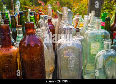 assorted old glass bottles displayed for sale Stock Photo