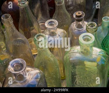 assorted old glass bottles displayed for sale Stock Photo