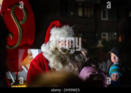 Warrington, Cheshire, UK. 05 December 2021 - Walton, near Warrington, Cheshire, has a gathering where Christmas Carols are sung and Father Christmas arrives to meet children and turn on the tree lights Credit: John Hopkins/Alamy Live News Stock Photo