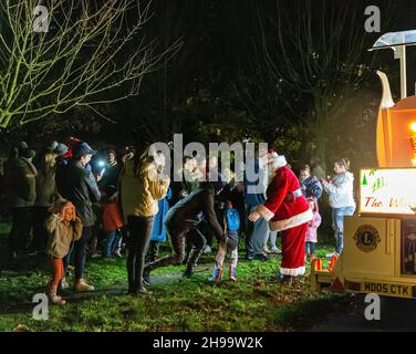 Warrington, Cheshire, UK. 05 December 2021 - Walton, near Warrington, Cheshire, has a gathering where Christmas Carols are sung and Father Christmas arrives to meet children and turn on the tree lights Credit: John Hopkins/Alamy Live News Stock Photo