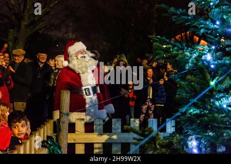 Warrington, Cheshire, UK. 05 December 2021 - Walton, near Warrington, Cheshire, has a gathering where Christmas Carols are sung and Father Christmas arrives to meet children and turn on the tree lights Credit: John Hopkins/Alamy Live News Stock Photo