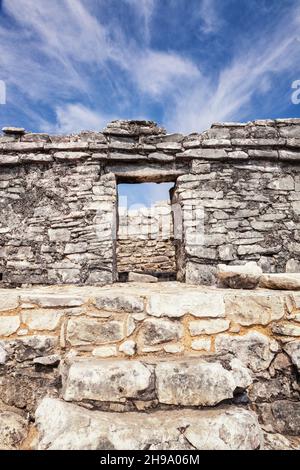 Stone steps and doorway in the archaeological site and Mayan ruins of Tulum Stock Photo