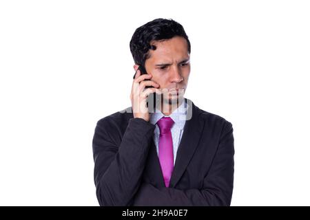 Elegant man talking on the phone with serious expression, isolated on white background. Stock Photo