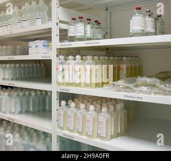 Modern hospital storage facilities, shelves of products for treatment and hospital procedures. Stock Photo