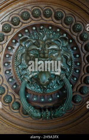 The brass decoration in the form of lion head door knocker on the door of Quinta da Regaleira, Sintra Stock Photo