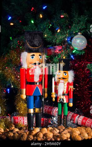 Christmas Nutcrackers with Nuts Tinsel and Christmas Tree Stock Photo
