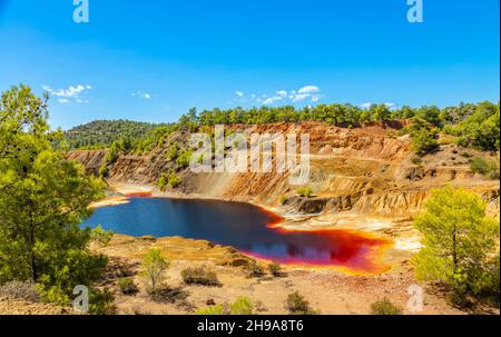 Red colored hazardous polluted Sha mine lake, Nicosia, Cyprus Stock Photo