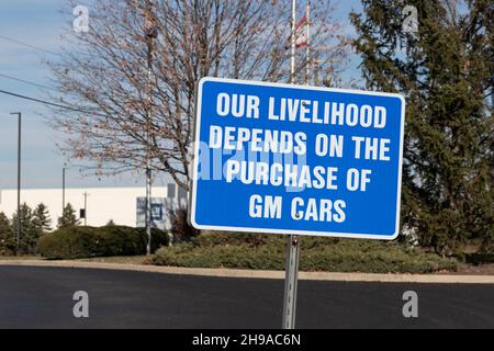West Chester - Circa December 2021: OUR LIVELIHOOD DEPENDS ON THE PURCHASE OF GM CARS sign at GM Service Parts Operations. Stock Photo