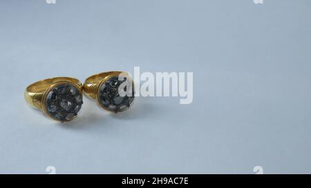 Pair of black diamond ring isolated on white background Stock Photo