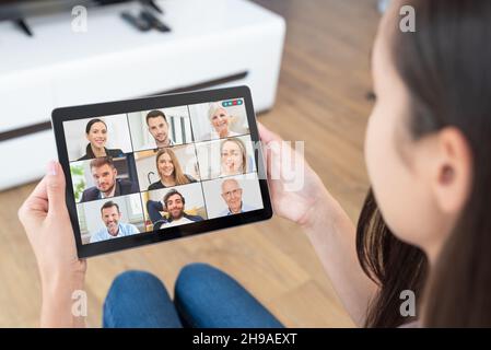 Video conference with multiple employees. Tablet application for remote work and study from home. Stock Photo