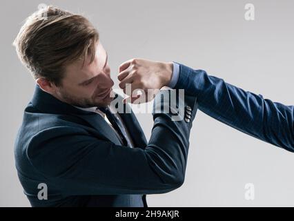 Defending himself from punch to face. Professional man defend punch. Self defence. Physical assault Stock Photo