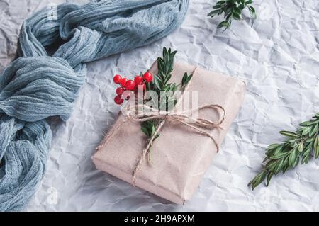 Gauze tablecloths on a gray background with spruce branches, blue gauze slider on a light crumpled background Stock Photo