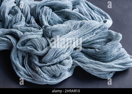 Gauze tablecloth on dark background,  blue gauze runner  on black paper Stock Photo