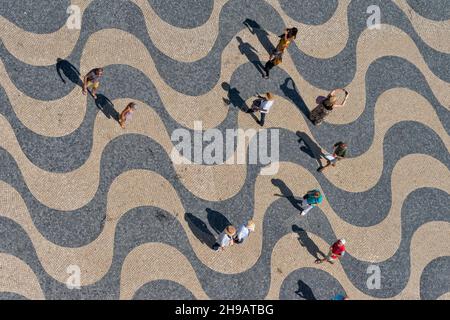 Geometric patterns of the compass rose created from beige, black and red limestone in the square of Monument to the Discoveries, Lisbon, Portugal Stock Photo