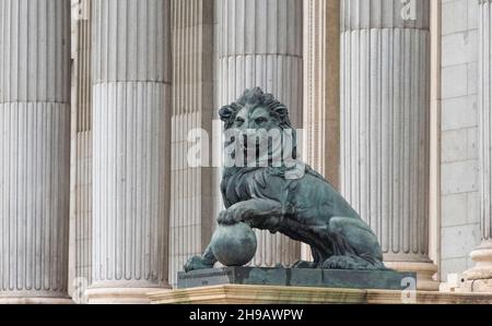 Lion statue and columns at the entrance to Congress of Deputies, seat of Spanish Parliament, Madrid, Spain Stock Photo