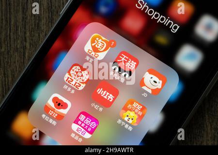 Chinese ecommerce apps (Taobao, Tmall, JD, Pingduoduo, Red, Suning, Kaola, VIP) with Double 12 ads are seen on an iPhone on Saturday, December 4, 2021. Stock Photo