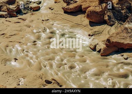 Mud on hiking trail in desert after rain season Stock Photo