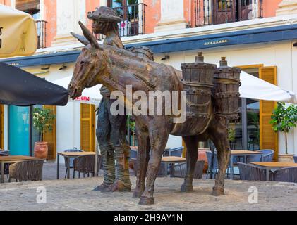 Man and donkey statue in Plaza de la Romanilla, Granada, Granada Province, Andalusia Autonomous Community, Spain Stock Photo