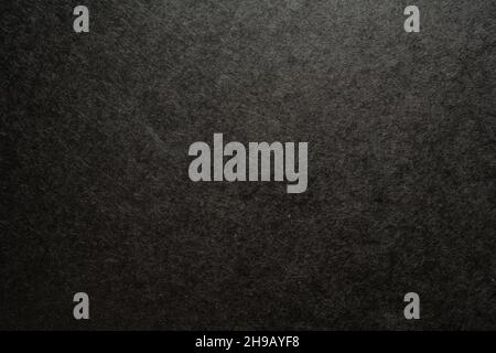 Black paper with uneven texture background Stock Photo