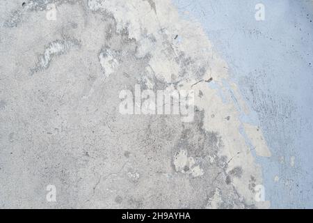 Concrete texture with worn out light blue paint Stock Photo
