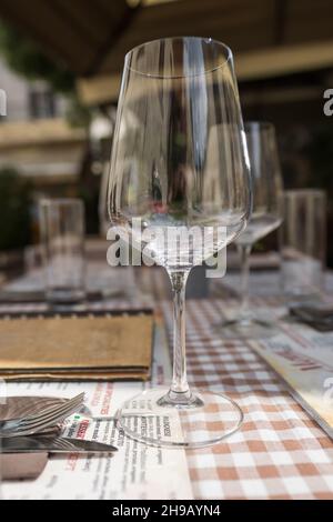 Empty wine glass on a restaurant table close-up Stock Photo