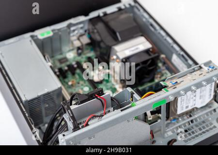Closed-up view of SSD Hard disk drive with connectors inside of business desktop PC Stock Photo