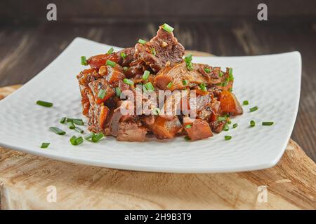 Jerusalem artichoke casserole with mushrooms and herbs, fried in pan Stock Photo