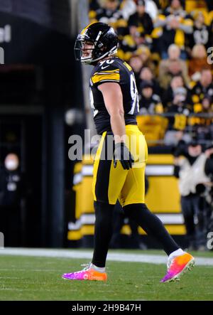 Pittsburgh Steelers vs. Baltimore Ravens. NFL Game. American Football  League match. Silhouette of professional player celebrate touch down.  Screen in background. Stock Photo