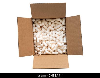 Isolated shipping brown box with packing peanuts on white background, Top view image brown cardboard box with safety foam protection item. The carton Stock Photo