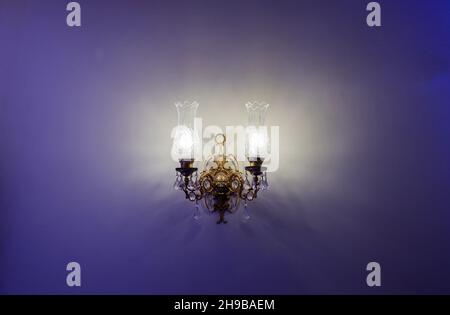 classic glass chandelier hanging on the wall Stock Photo