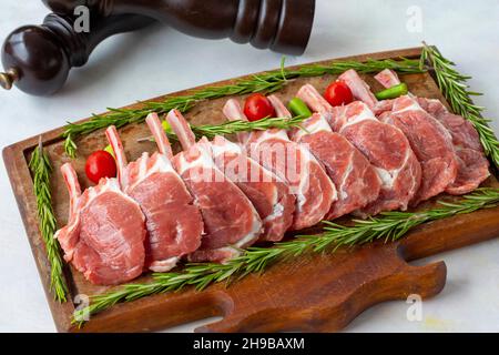 Lamb chops on wooden background Stock Photo