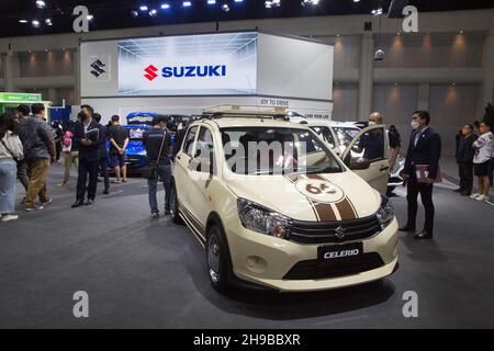 Parkked, Thailand. 04th Dec, 2021. Motor Expo visitors looking at cars from Suzuki.The event 'The 38th Motor Expo - Motor Expo 2021' under the concept of 'Happy Motor Vehicles' (TIME to ENJOY!), a meeting place and exchanging opinions of those who love cars This event collects new cars of the year. with full promotions for the end of the year 2021, starting from 1-12 December 2021 at the IMPACT Challenger 1-3 Building, Muang Thong Thani. (Photo by Atiwat Silpamethanont/Pacific Press) Credit: Pacific Press Media Production Corp./Alamy Live News Stock Photo