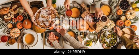 People feasting at autumn festive table, top view Stock Photo