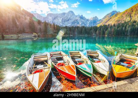 Marvelous view of sunset over Fusine lake with Mangart peak on background. Popular travel destination of Julian Alps. Location: Tarvisio comune , Prov Stock Photo