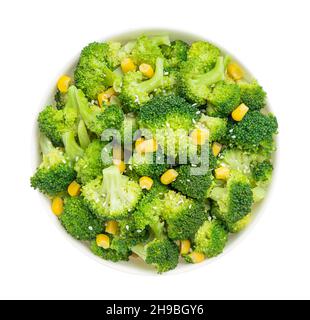 Broccoli salad bowl isolated on white background with clipping path. Top view. Stock Photo