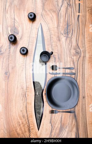 Various black items on a handmade epoxy resin table Stock Photo