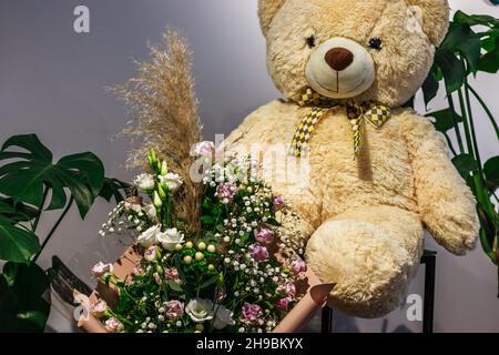 flowers and toy decoration composition on the gloomy background Stock Photo