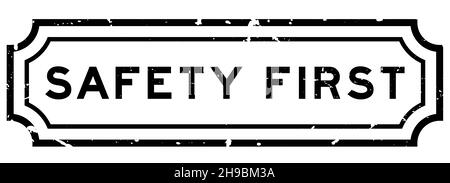 Grunge black safety first word rubber seal stamp on white background Stock Vector