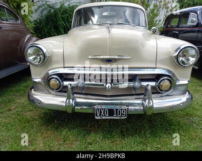 LOMAS DE ZAMORA - BUENOS AIRES, ARGENTINA - Dec 05, 2021: shot of an old American Chevrolet Chevy Bel Air four door sedan 1953 by GM. Front view. CADE Stock Photo