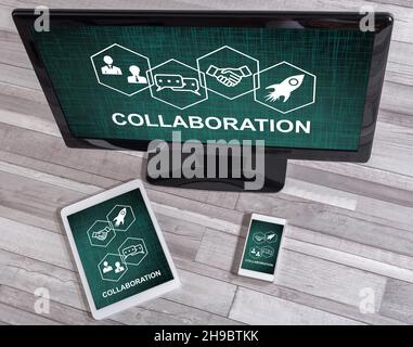 Collaboration concept shown on different information technology devices Stock Photo